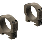 Pair of brown rifle scope rings mounting clamps, shown from angled views for optic attachment