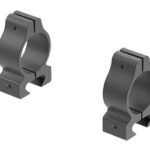 Two gray metal rifle scope rings/clamps (scope mounts) shown from an angled perspective.