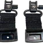 Pair of black adjustable strap clips with woven nylon straps and metal bases, used to secure and lengthen a strap.