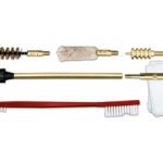Gun cleaning kit with brass cleaning rods, brushes, jags, patches, a bore snake, solvent bottle, and cloth
