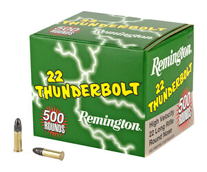 Remington .22 Thunderbolt ammunition box with two bullets beside it on a white background.