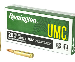 Remington UMC box of 20 centerfire rifle cartridges with two copper bullets placed beside it.