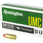 Remington UMC ammunition box reading '50 centerfire cartridges,' with two brass bullets beside it.