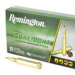 Remington Core-Lokt tipped rifle ammunition box with two loose cartridges beside it.