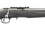 Bolt-action rifle with a long barrel and black synthetic stock, shown from the side with a scope rail.