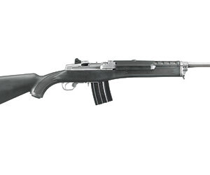Profile view of a black assault rifle with a curved magazine and a long barrel, shown in side view.