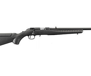Side view of a black bolt-action rifle with a long barrel and ergonomic stock.