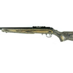Side view of a double-barreled shotgun with a wooden stock and fore-end.
