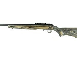 Side view of a double-barreled shotgun with a wooden stock and fore-end.