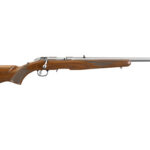 Bolt-action rifle with a wooden stock and long metal barrel, shown in profile (side view).