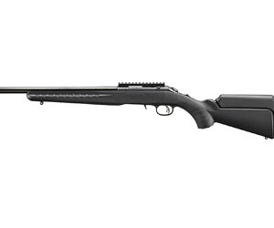 Long black rifle with a long barrel, scope rail, and adjustable buttstock seen from the side.