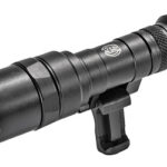 Black tactical flashlight with a Picatinny rail mount, designed for mounting on firearms (rifle/weapon rail).