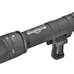 Compact black tactical flashlight with a Picatinny rail mount attached.
