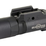 Black SureFire tactical flashlight with a mounting rail, designed to attach to a firearm for illumination.