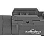 Black SureFire weapon-mounted flashlight attached to a rifle rail, shown from the side.