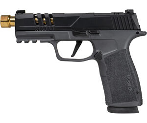 Side-view of a black semi-automatic pistol with a textured grip and a gold-colored muzzle adapter