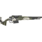 Camouflage-pattern bolt-action rifle shown in profile with a long barrel and attached magazine.