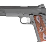 Semi-automatic pistol shown in left-side profile with a gray frame and brown textured grip.