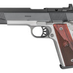 Side view of a silver and black semi-automatic pistol with wooden grip panels and green front sights.