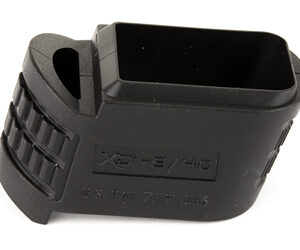Black plastic firearm accessory with a large rectangular slot and ribbed grip, viewed from above.