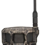 Camouflage wildlife trail camera with external antenna and lens, used for monitoring animals.
