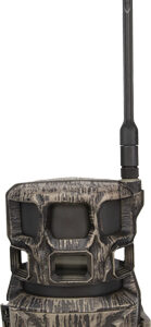 Camouflage wildlife trail camera with external antenna and lens, used for monitoring animals.