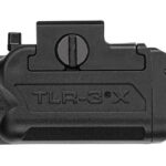 Side view of a black TLR-3 compact weapon light, showing the rail-mount and activation switch.