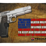 Silver semi-automatic handgun on a textured background with bold blue and red Second Amendment text and TekMat logo.