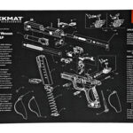 Exploded view diagram of a Smith & Wesson M&P handgun on a Tekmat parts mat, showing labeled components for assembly or disassembly.