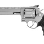 Side view of a silver revolver with a long barrel and black textured grip