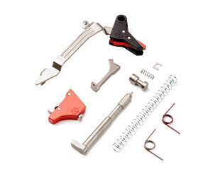 Assorted metal repair tools and components laid out on a white background.