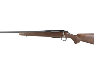 Bolt-action rifle with wooden stock and long blued barrel, shown in profile from the left.