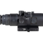 Long-range rifle scope with adjustable turrets mounted on a black rail, shown in profile.
