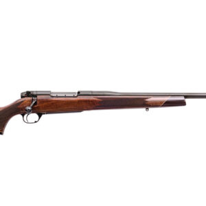 Bolt-action rifle with a polished wooden stock and long metal barrel, shown in profile.