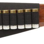 Shotgun stock with five shotgun shells in a black shell holder along the side.
