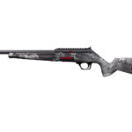 Snow-covered sniper rifle with long barrel and angular stock, shown in profile.