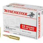 Winchester ammunition box labeled '60 round value pack' with two bullets beside, 65 Creedmoor 125 grain.