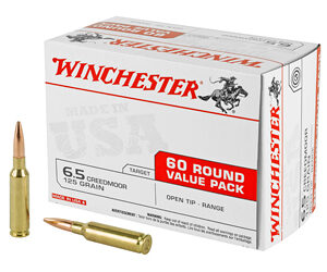 Winchester ammunition box labeled '60 round value pack' with two bullets beside, 65 Creedmoor 125 grain.