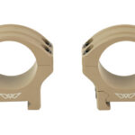 Pair of tan rifle scope rings shown side by side, front view against a white background