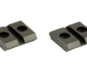 Two small dark gray metal clamp blocks, each with two circular holes, placed on a white background side by side on a diagonal axis.