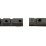 Two black LEGO plates, a 1x3 on the left and a 1x2 on the right, placed on a white background.