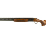 Side view of a long-barrel shotgun with a wooden stock and fore-end.