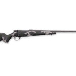 Camouflage-pattern bolt-action rifle shown in profile with a long barrel and wooden stock detailed in camo fabric.