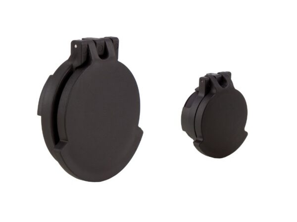 Pair of black circular camera lens caps, large and small, with hinged locking clips on the top against a white background.