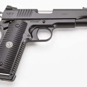 Side view of a black semi-automatic pistol with textured grip and engravings 'ACP' and 'Wilson Combat' on the slide, on a white background.
