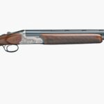 Side view of a double-barrel shotgun with a wooden stock and engraved silver receiver.
