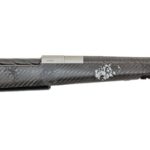 Bolt-action hunting rifle with a gray camouflage stock and long carbon-fiber patterned barrel (no scope shown).