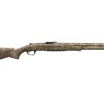 Camouflage-pattern hunting shotgun with a long barrel and textured stock viewed from the side.
