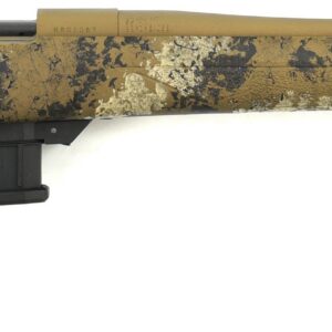 Desert camouflaged bolt-action rifle with a long tan barrel and a detachable box magazine.