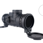 Black Trijicon MRO rifle scope with side adjustment dial and open front lens cap, used for precision aiming.